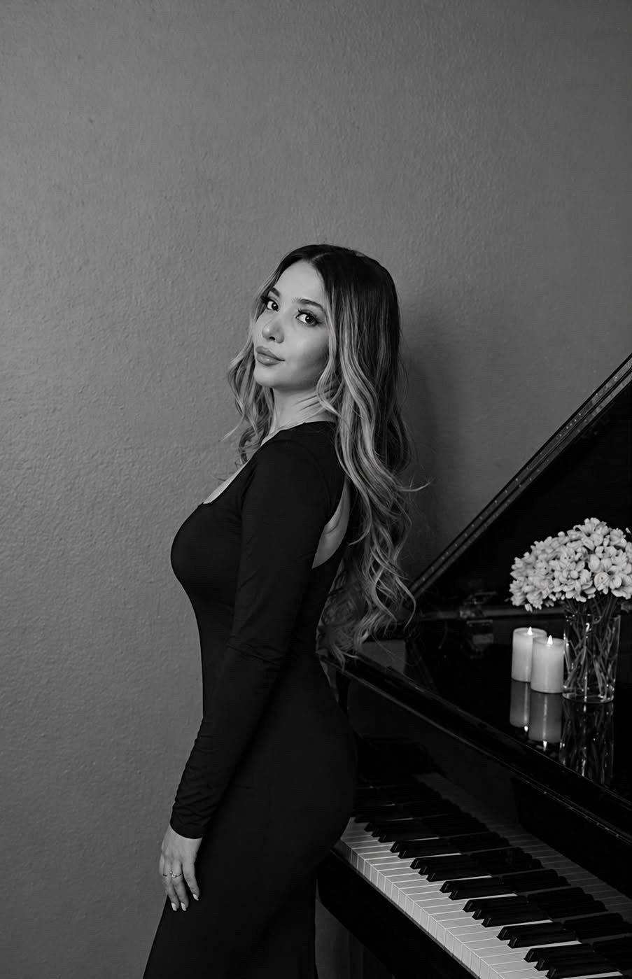 Anush Hambardzumyan beside a piano