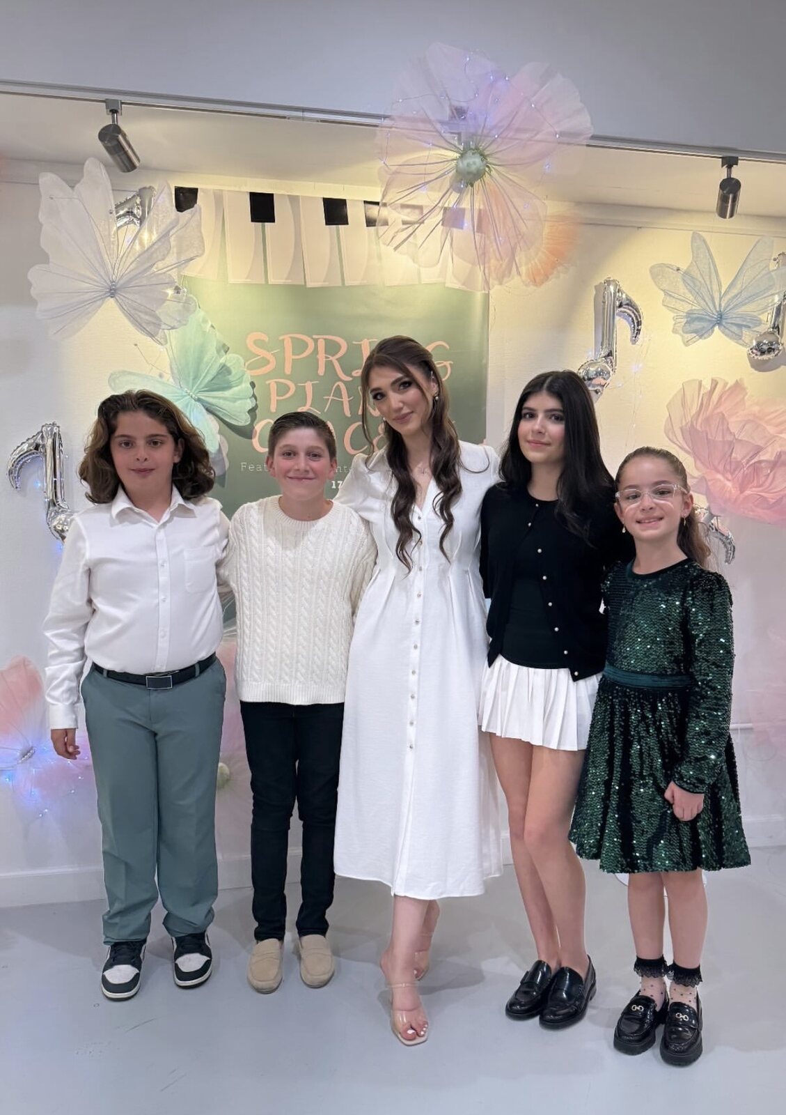 Luiza with students after the Spring Piano Concert